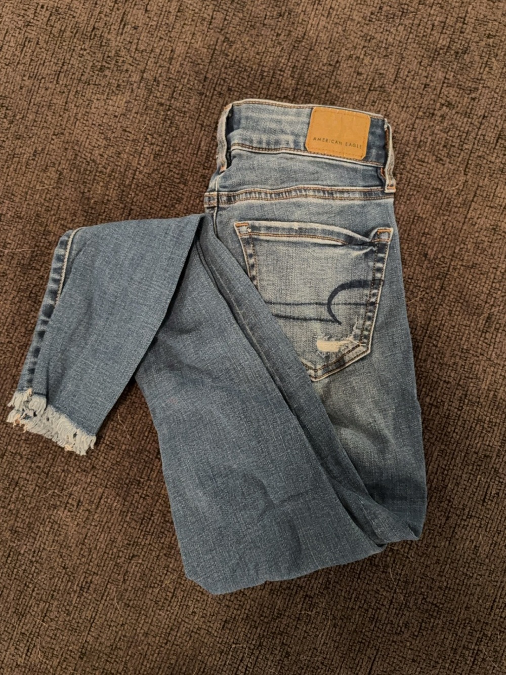 American Eagle Outfitters Light/Medium Wash Skinny Jeans with Frayed Hem
